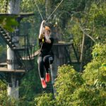 Soaring on treetop over Angkor Park