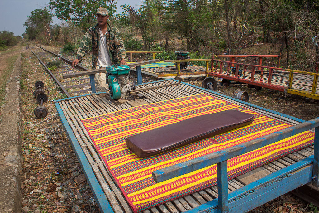 Bamboo train in Cambodia and a driver